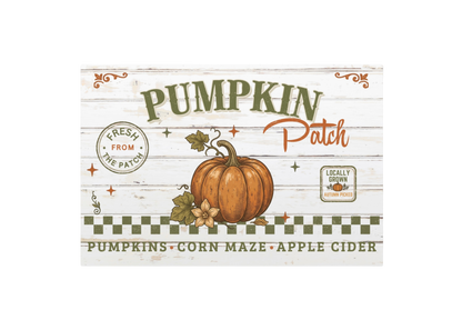 A rectangular printed sign or label with a rustic white wood-plank background and the words “Pumpkin Patch” in large green and orange lettering. A brown-orange pumpkin illustration sits in the center, with smaller text reading “Fresh from the Patch,” “Locally Grown Organic Farms,” and “Pumpkins Corn Maze Apple Cider.